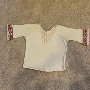 Ladies small, cream colored shirt.  Flared sleeves.
